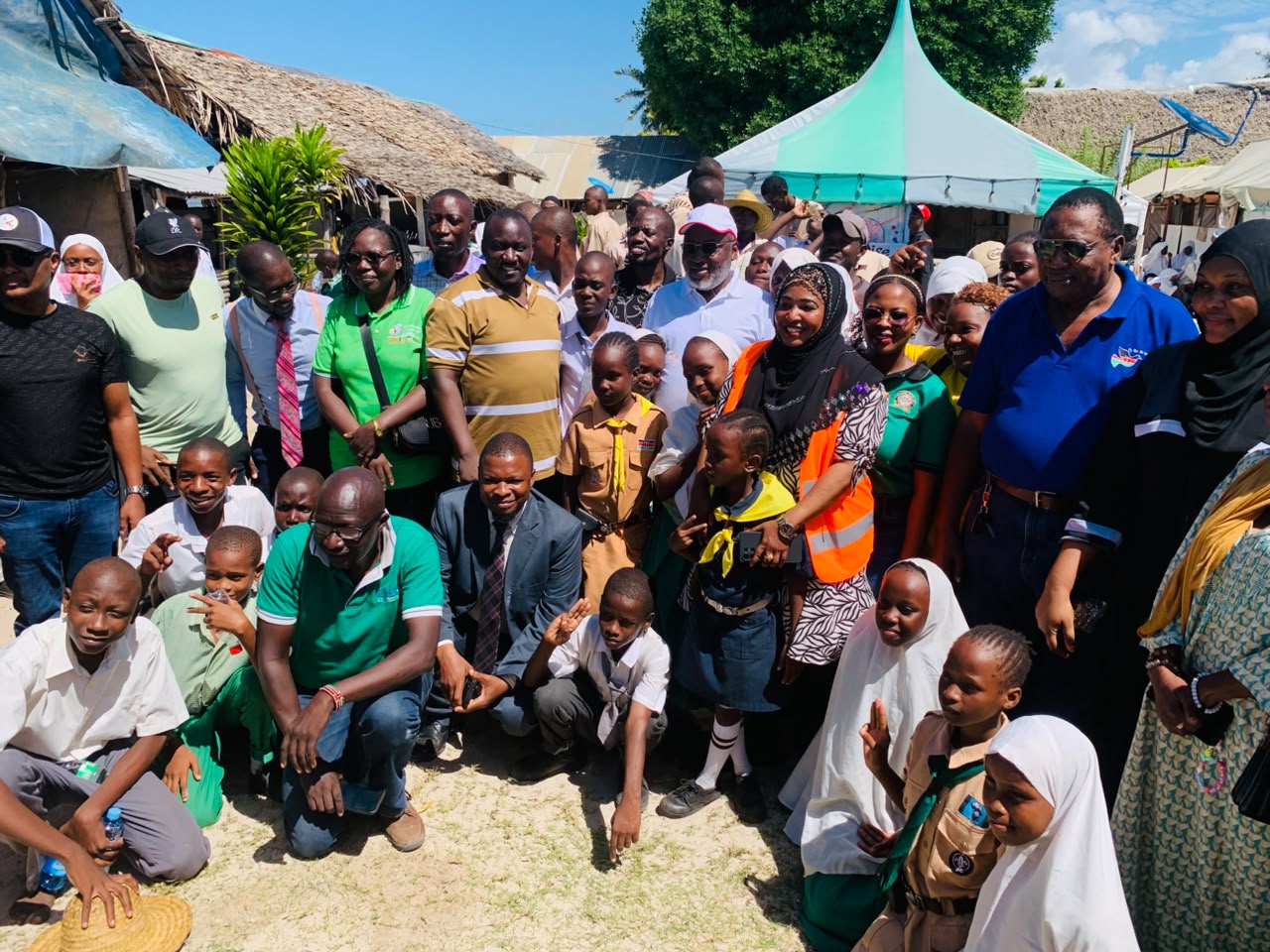 Foundation representatives with schoolchildren and community leaders in Likoni