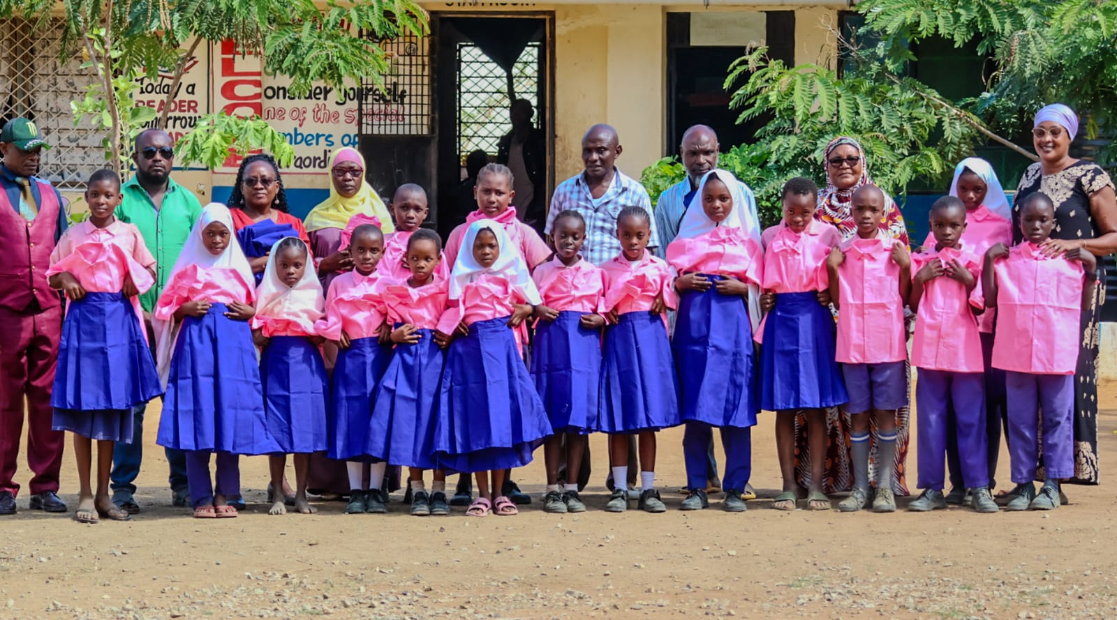 Schoolchildren proudly wearing newly donated uniforms